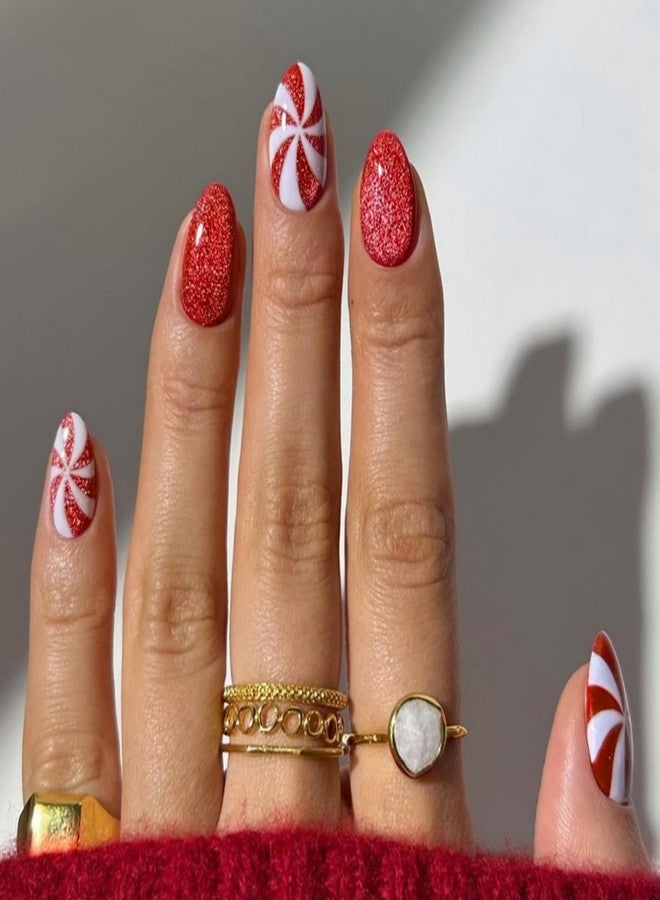 Sevgob Christmas Press on Nails Medium Almond Nails Press on with Cute Candy Design Glossy Red Glitter Glue on Nails Cat Eye False Nail Reusable Full Cover Winter Xmas Fake Nail for Women Manicure 24Pcs - Image 1